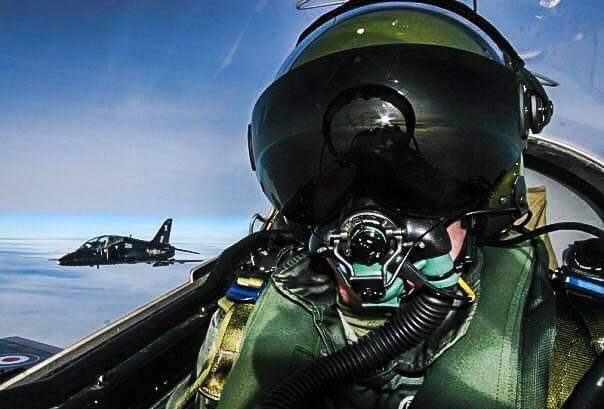 military pilot wearing a flight helmet