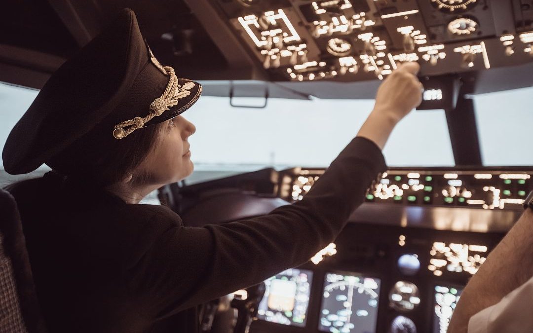 female pilot in cockpit